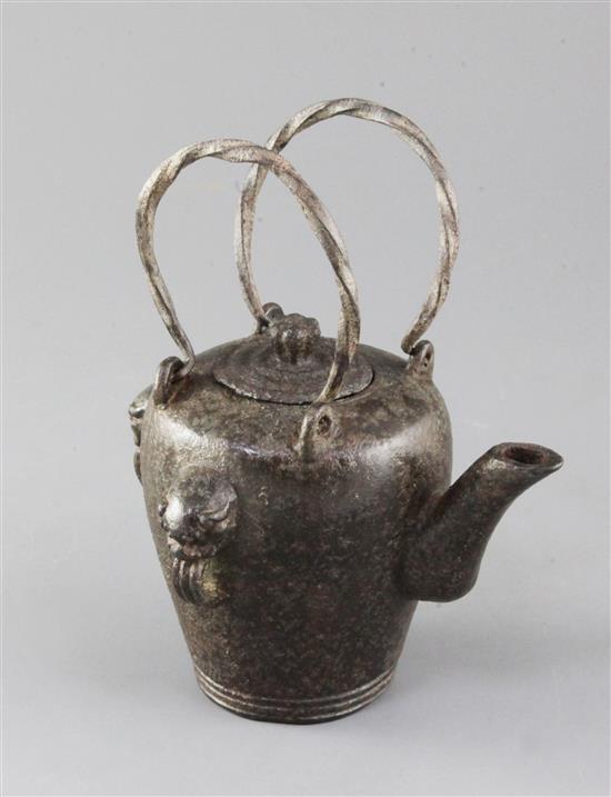 A Chinese iron temple teapot and cover, Qianlong mark and of the period, height 20cm with handles upward